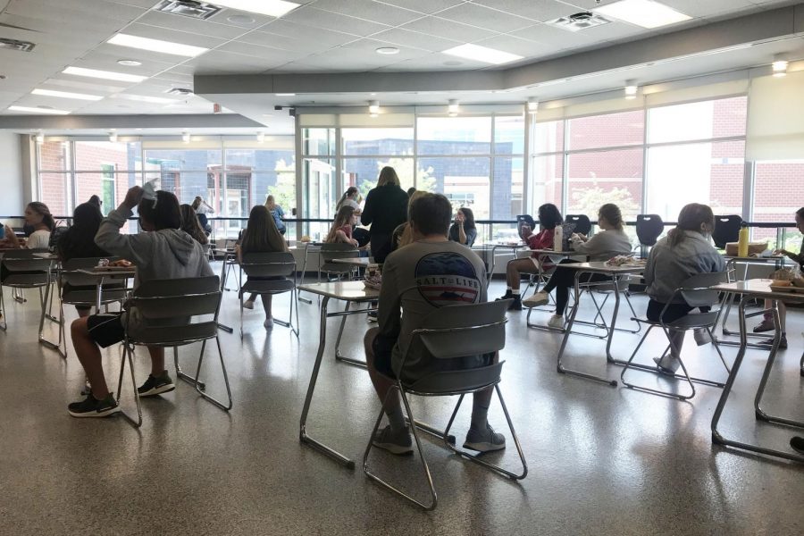 Eating lunch in the Senior Cafe, students are confined to sit at individual tables.