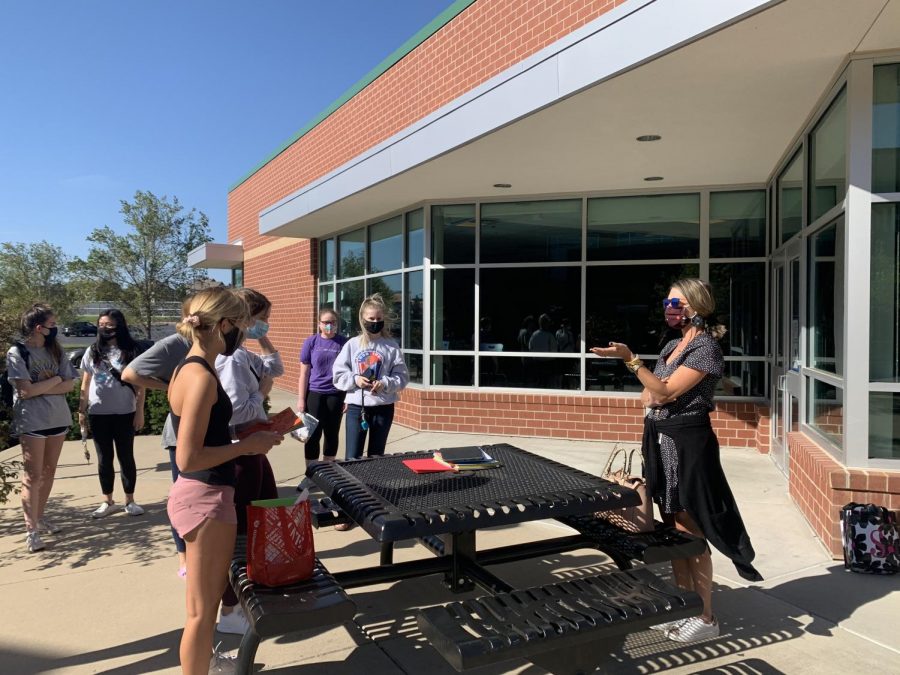 Mrs. Sides explains the first project of the year for NHS students