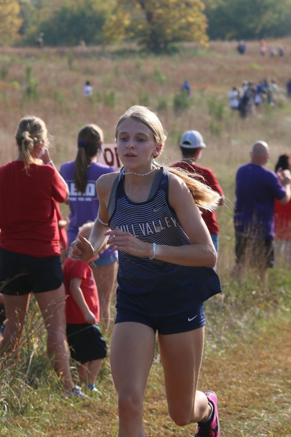 Running at a steady pace, junior Bridget Roy focuses on running at a steady pace.