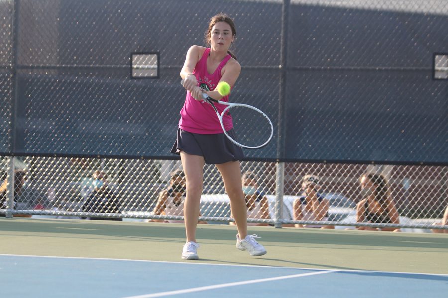 Eyes on the ball, junior Eden Schanker holds out her racket in preparation.
