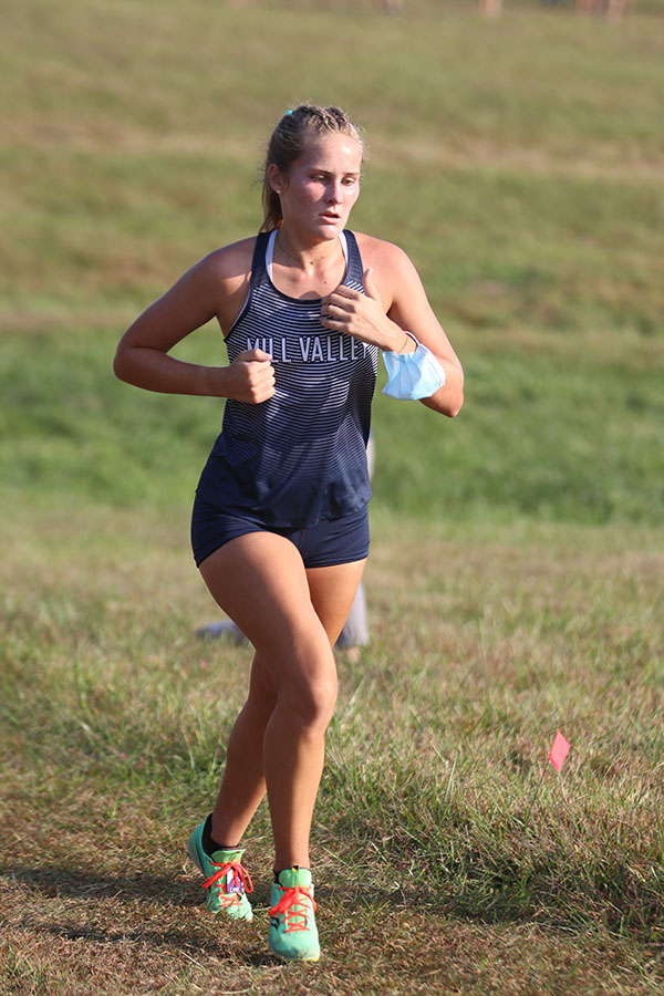 Focusing, senior Emma Schieber continues running toward the finish line.
