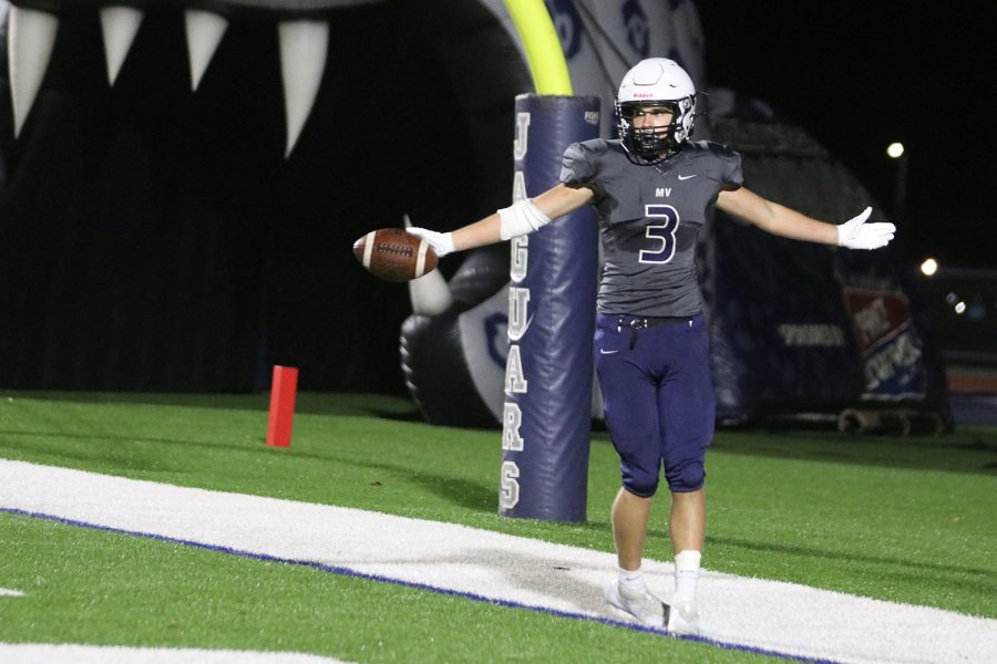 With his hands out, senior Jacob Hartman celebrates his touchdown.
