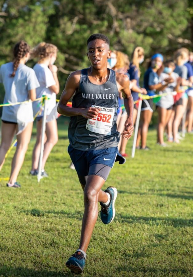 Sprinting to secure his placement, freshman AJ Vega finishes in fifth place with a time of 17:10 at the DeSoto Triangular meet Saturday, Sept. 4