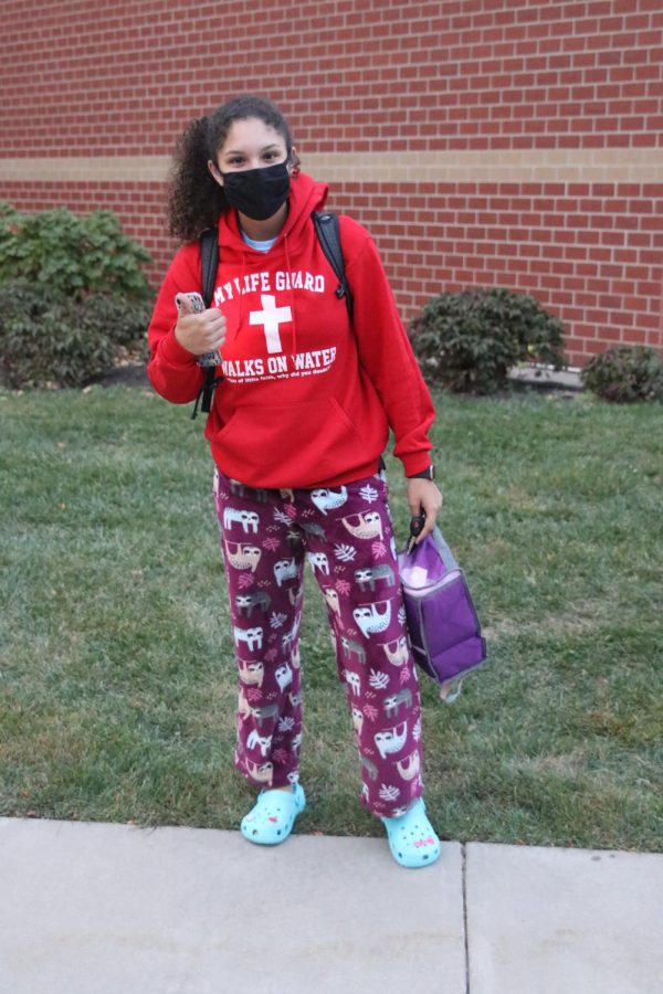 Dressed in sloths PJ pants and crocs, junior Jordin Harris poses in front of MV.
