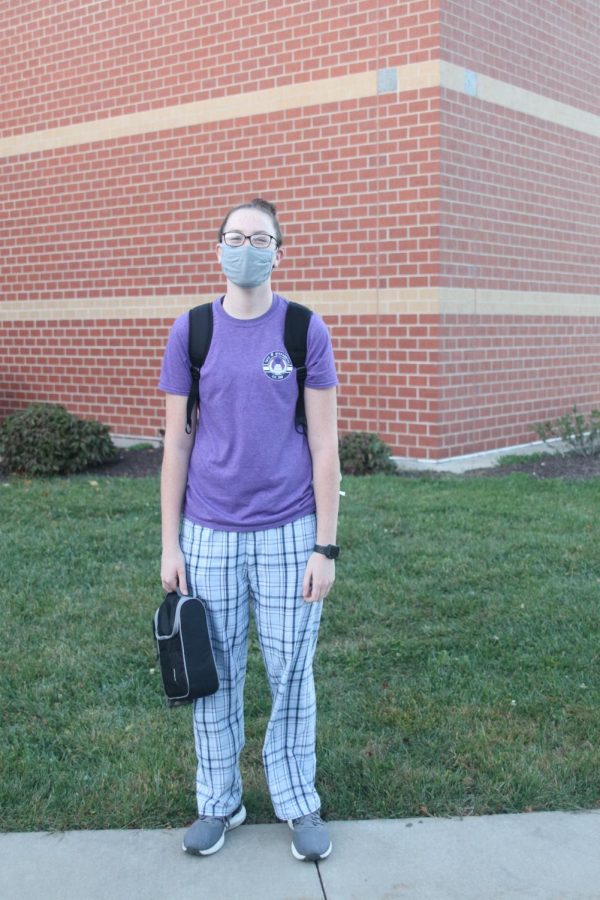 Posed in her plaid PJs is junior Madison Vosburg showing her spirit for homecoming week.