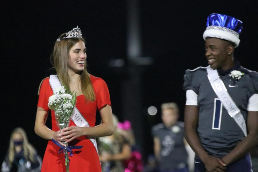 After being announced king and queen, Ellie Boone and Quin Wittenauer smile at their new title.