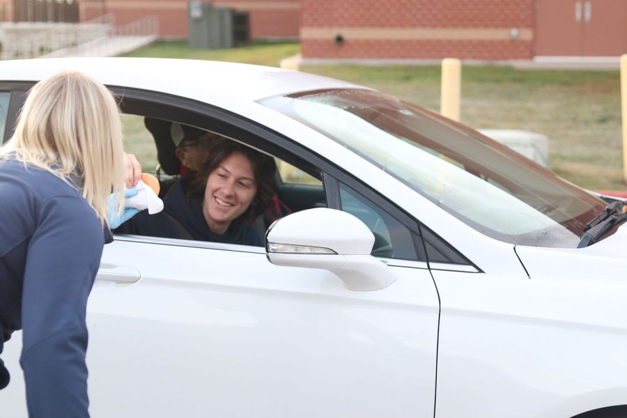 Senior Davis Mason pulls up to school with his dad to get some breakfast.
