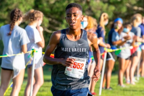 Sprinting to secure his placement, freshman AJ Vega finishes in fifth place with a time of 17:10 at the DeSoto Triangular meet Saturday, Sept. 4