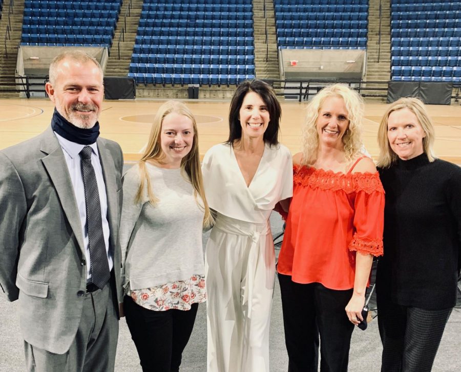 With smiles on their faces, athletic director Jerald VanRheen, math teacher Sarah Heffernon, PE teacher Debbie Fay, PE teacher Christine Preston and Assistant Principal Marilyn Chrisler stand for a photo after Fay was awarded into the Hall of Fame on Sunday, Nov. 15. 