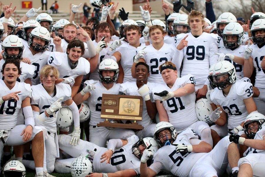 Holding their 5A state trophy at midfield, the football team celebrates its second consecutive state championship. The team defeated Wichita Northwest 49-35 in a rematch of last years title game Saturday, Nov. 28.