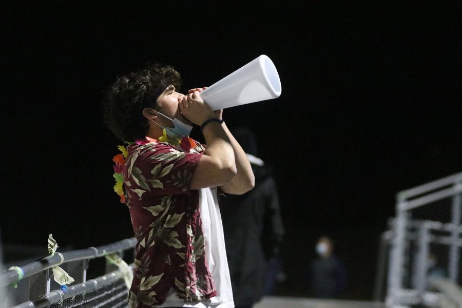 Yelling, senior Nick Lightcap leads a chant in the student section.
