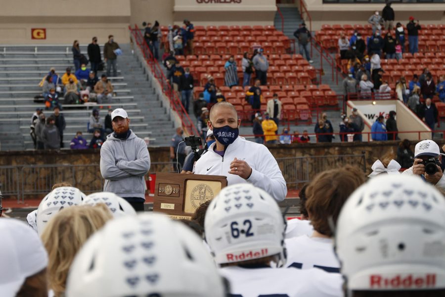 With the state championship trophy in hand, coach Joel Applebee gives a speech to the team about their season. 
