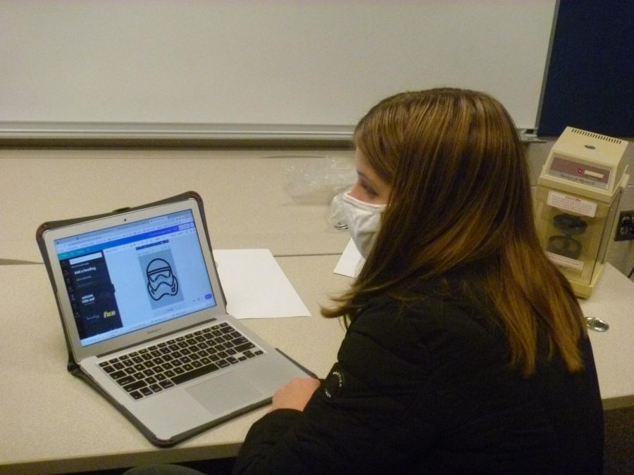 New robotics recruit freshman Ashlyn Bellmyer practices using Canva to make fundraising posters for the marketing team Thursday, Nov. 19