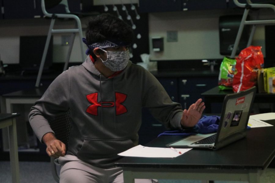 Freezing in place, senior Manoj Turaga stares at his screen focusing on solving the problem. 