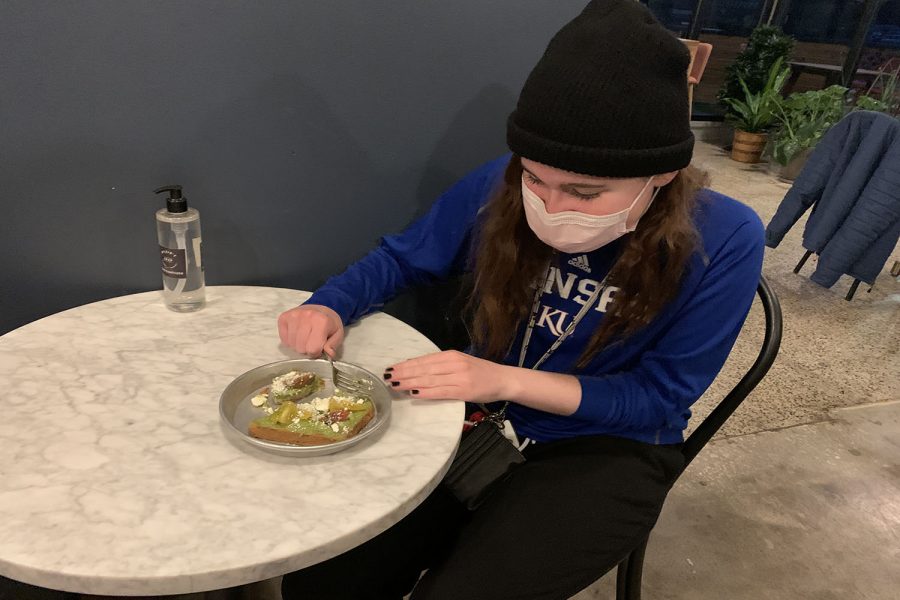 Eating her food, junior Ali Beall has the avocado toast which is $6.