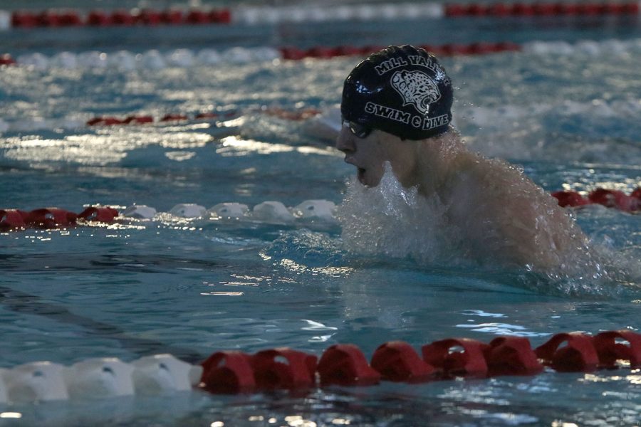 Taking a breath, sophomore Adam Budimlija competes in the 200-yard breaststroke relay Saturday, Dec. 5. 