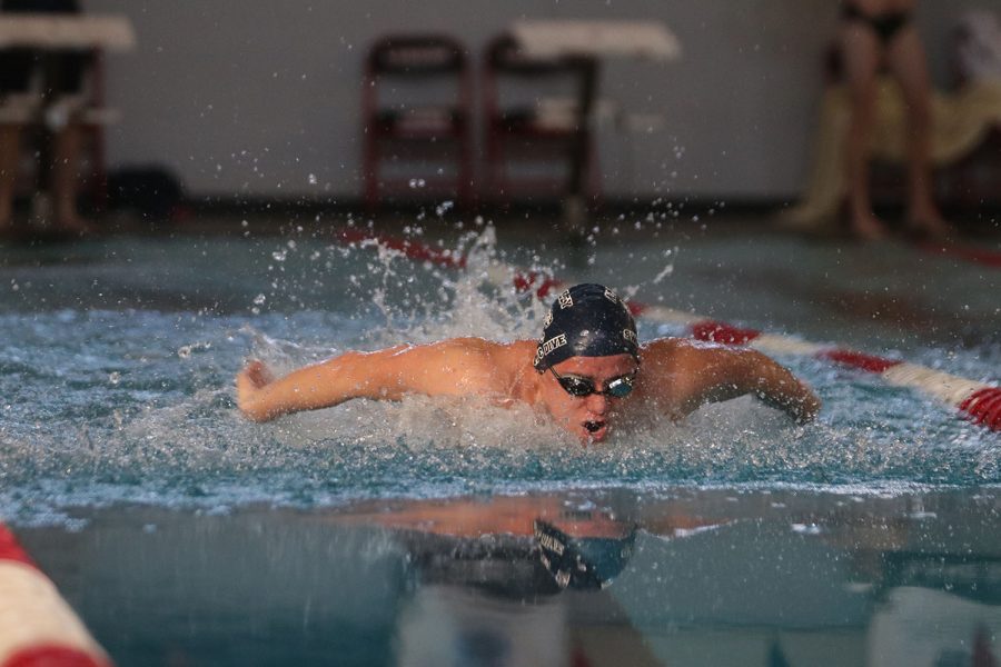 Arms extended, senior Noah Collins focuses on finishing the race.
