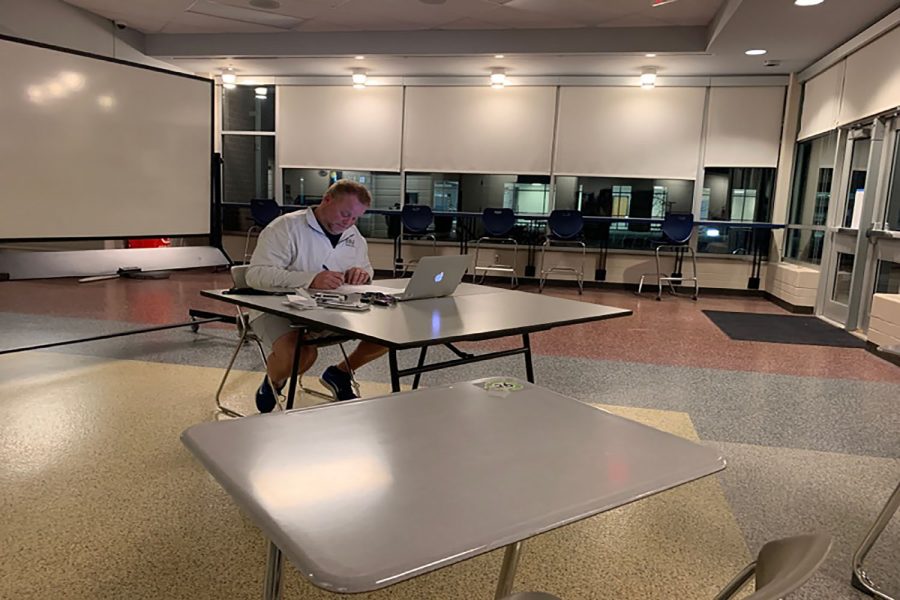 Ready to assist math teacher Kevin Mosher sits and waits for students to show up to his study hall on Monday, Dec. 7
