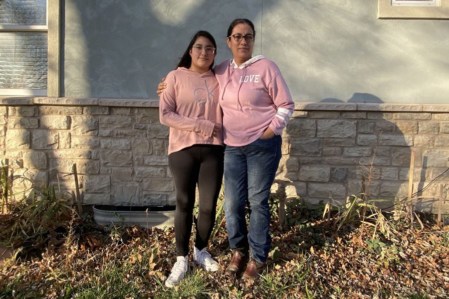 During their annual Christmas family tradition of making tamales for family and friends, sophomore Andrea Rios Rico stands beside her mother Rosalia Rico Rivera on Saturday, Nov. 10.