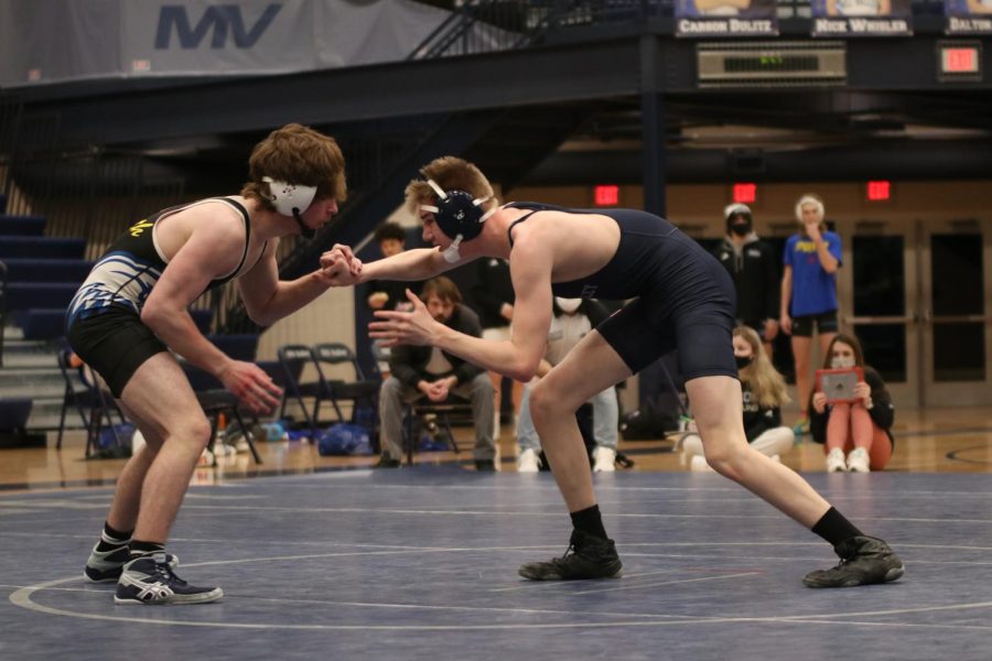Pushing against his opponent’s arms, sophomore Sam Imes looks for a way to strike first.