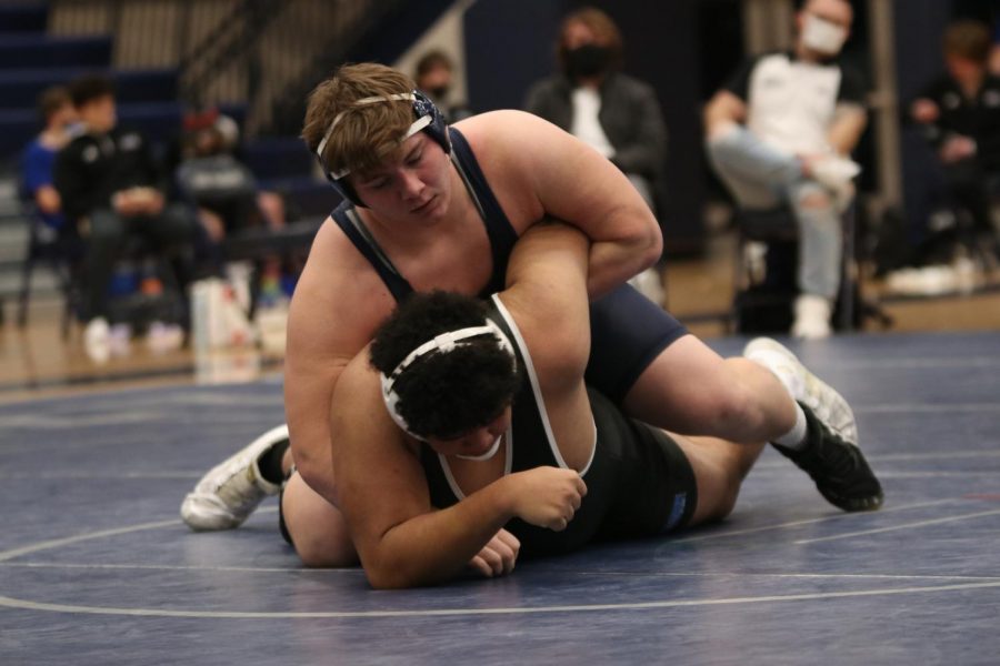 With his opponents elbow pulled back, senior Ethan Kremer leaned over him before pulling him onto his back.