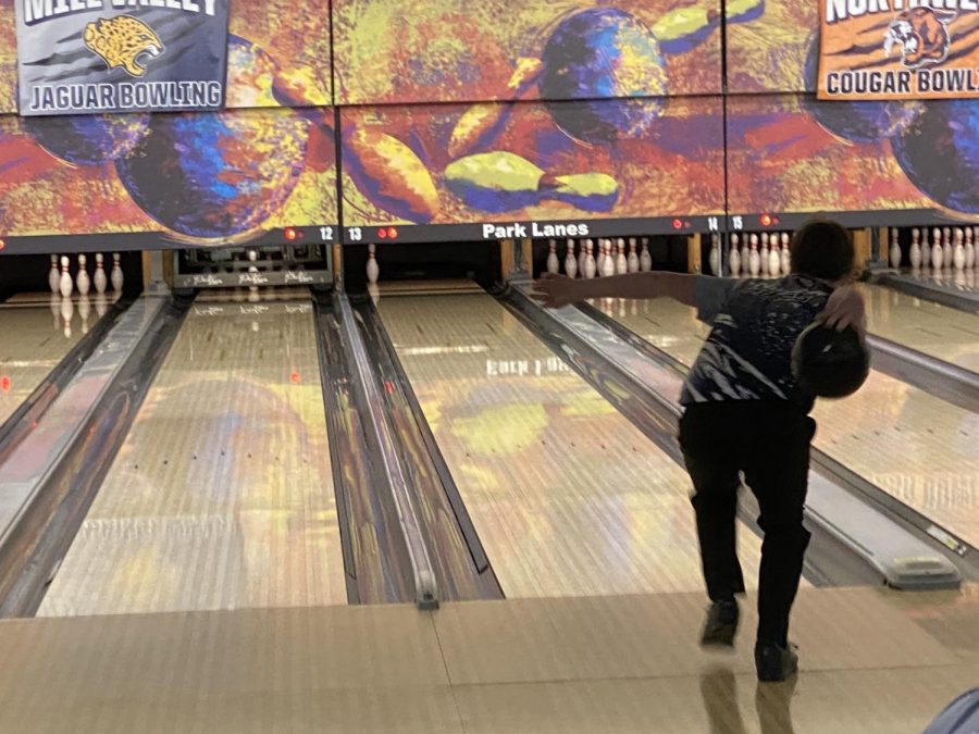 Getting ready to throw the ball, freshman Andrew Kouris aims the ball for the last pin to secure a spare.