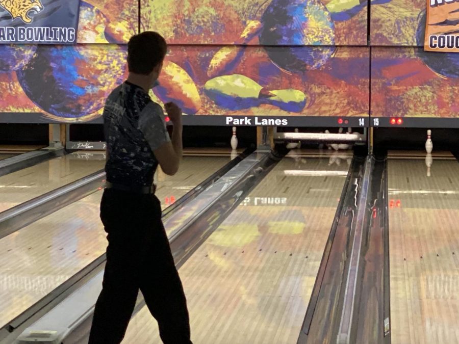 Pumping his fist in celebration, senior Carsyn Turpin, bowls a strike. 