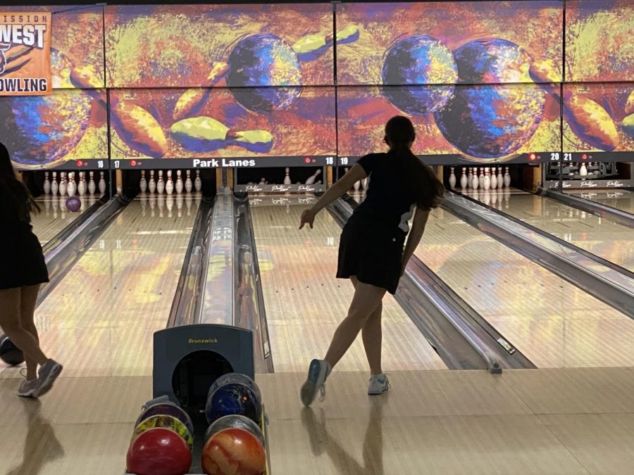 Releasing the ball down the lane, Kiara Gonzalez bowls a perfect strike.