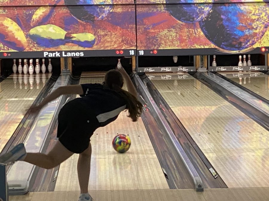 Still mid throw, freshman Kiara Gonzalez has to aim the ball at the single pin for the spare at the tournament on Tuesday, Jan. 26..