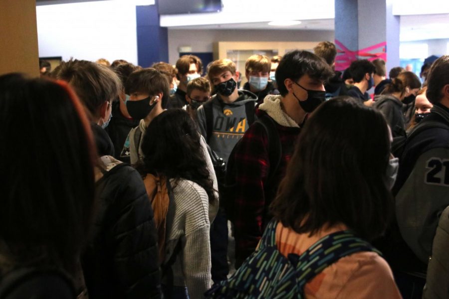 Students walk silently to their classes.