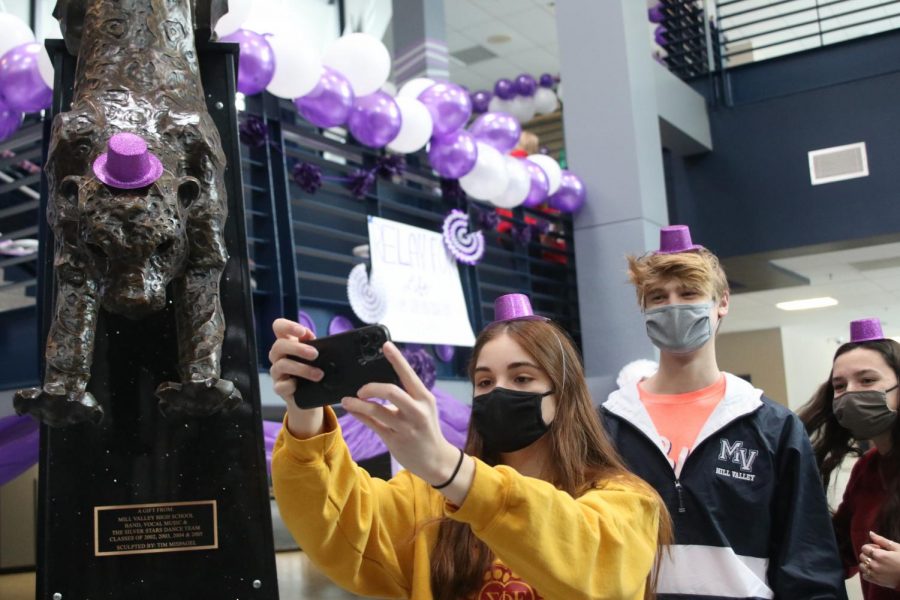 Taking a selfie, senior Ellie Boone and junior Bret Weber smile under their masks during the Relay for Life purple bomb on Monday, Jan. 25. As student body president, Boone has spent the year brining students together in new ways during COVID-19, like assisting with the RFL purple bomb. 