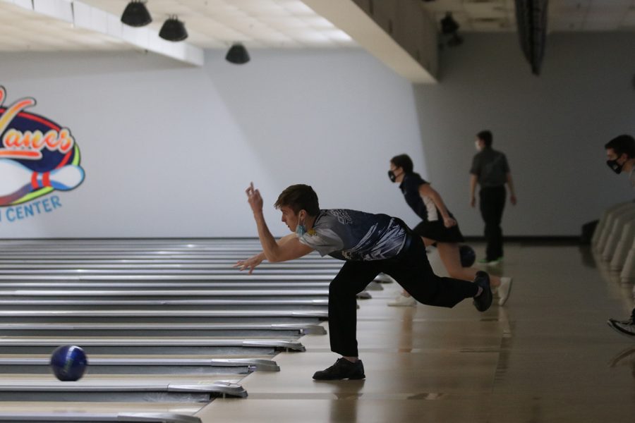 With his arm up, senior Carsyn Turpin follows through with his throw.