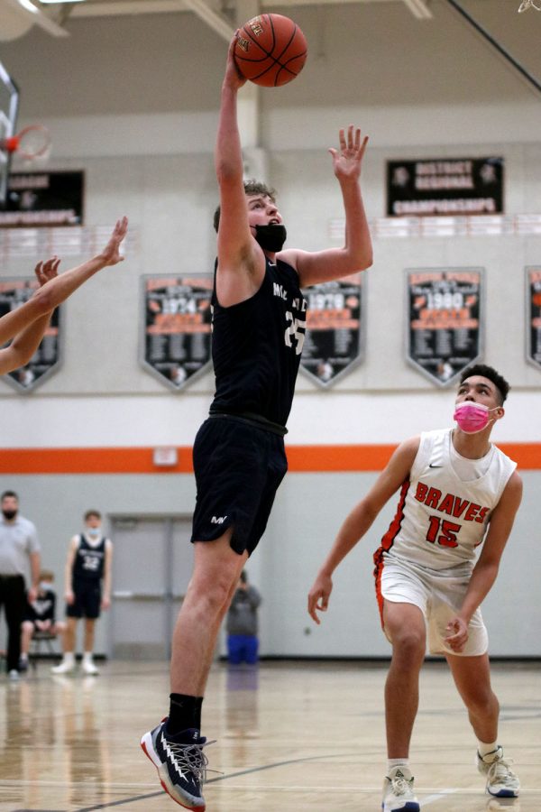 With no one guarding him, senior Aaron Kephart makes an easy shot right beside the basket. 