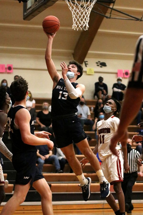 Shooting a layup, senior Pete Janssen makes the shot.