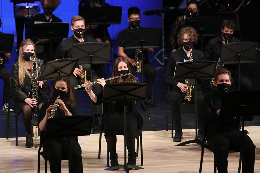 Up on the new stage, junior Ashley Atkinson plays her flute. 