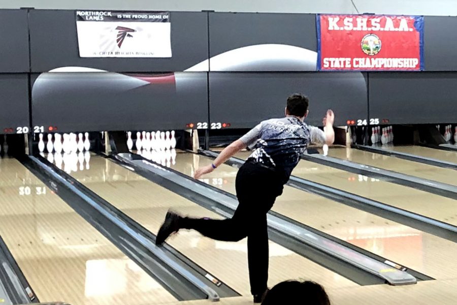 After missing the first shot, senior Jackson Penny hopes to hit all the pins for a spare. 