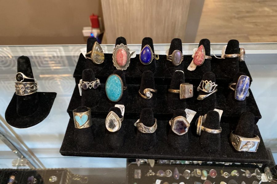 By the register, there is a display case housing a variety of unique rings.