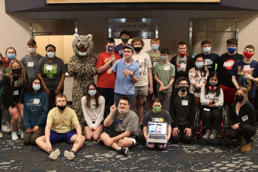 After completing the Job Olympics, peers-in-learning students and special education students stand alongside one another to pose for a photo on Tuesday, March 9.