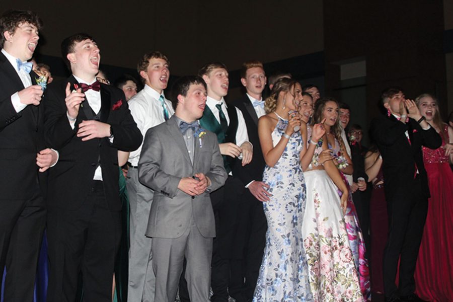 Enjoying+the+prom+king+and+queen+dance+on+Saturday%2C+May+4%2C+2019%2C+a+group+of+students+sing+along+to+Sweet+Caroline.+I+thought+%5Bprom%5D+was+more+fun+than+Homecoming.+I+dont+really+like+school+dances%2C+but+I+had+a+great+time%2C+junior+Nick+Teeple+said.+I+think+it+was+because+it+was+only+upperclassmen+and+all+my+friends+are+upperclassmen.