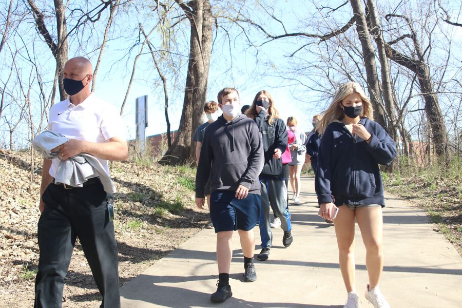 At the Gamblin Park trail, science teacher Eric Thomas’s class enters the trails to identify more birds. 