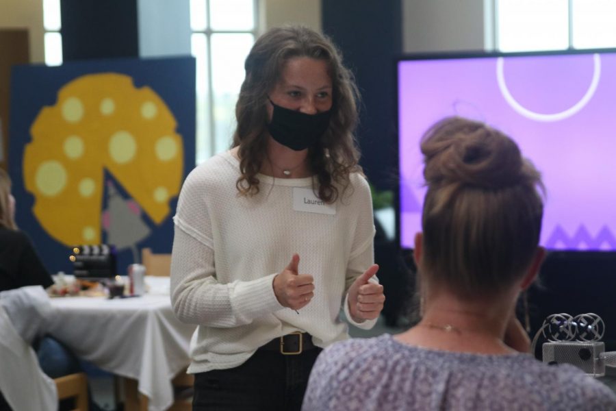 Thumbs up, junior Lauren Walker finishes checking on her guests.