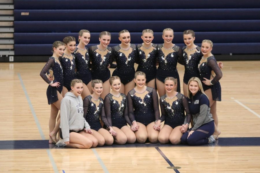 Before filming their dance routine for the National Dance Association, the team poses for a photo on Tuesday, April 13. 