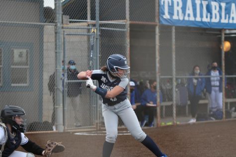 Getting ready to swing her bat, sophomore Adisyn Hopkins waits for the ball. 