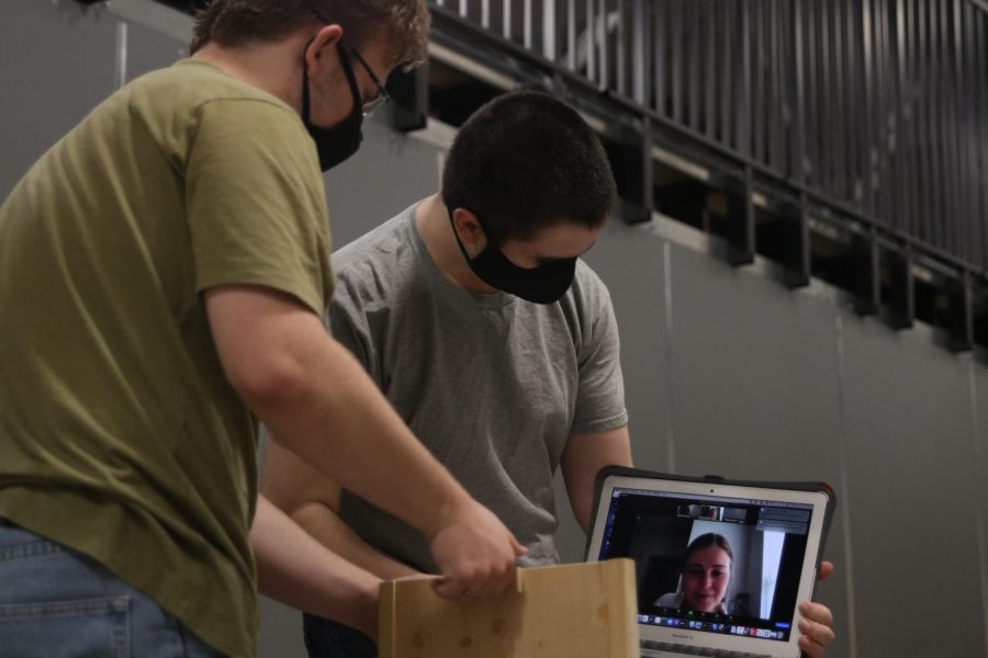 During their gravity vehicle event, junior Jordan Manning and senior Andrew Gawith show their judge the dimensions of their ramp Wednesday, March 31.