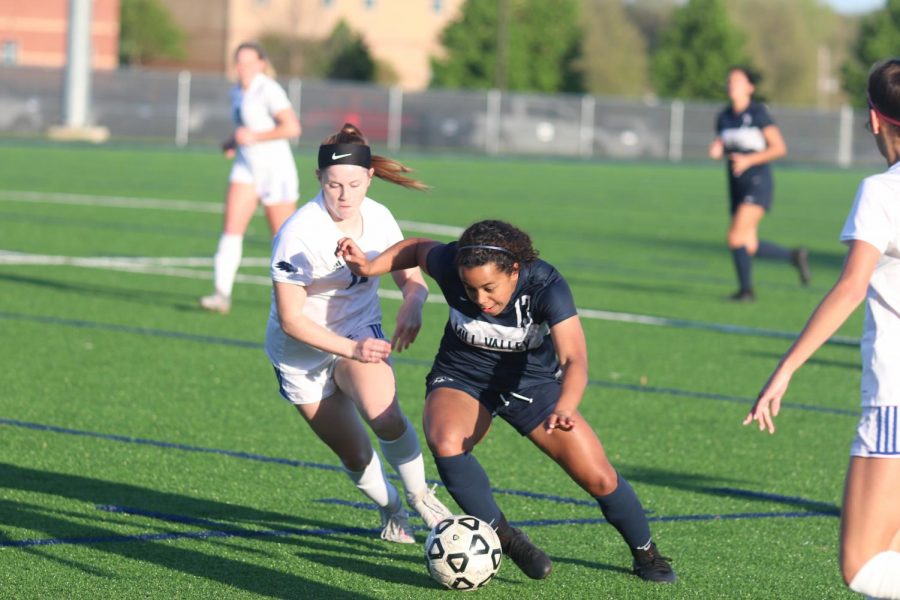 Eyes on the ball, sophomore Hadley Lockhart protects the ball from defenders. 