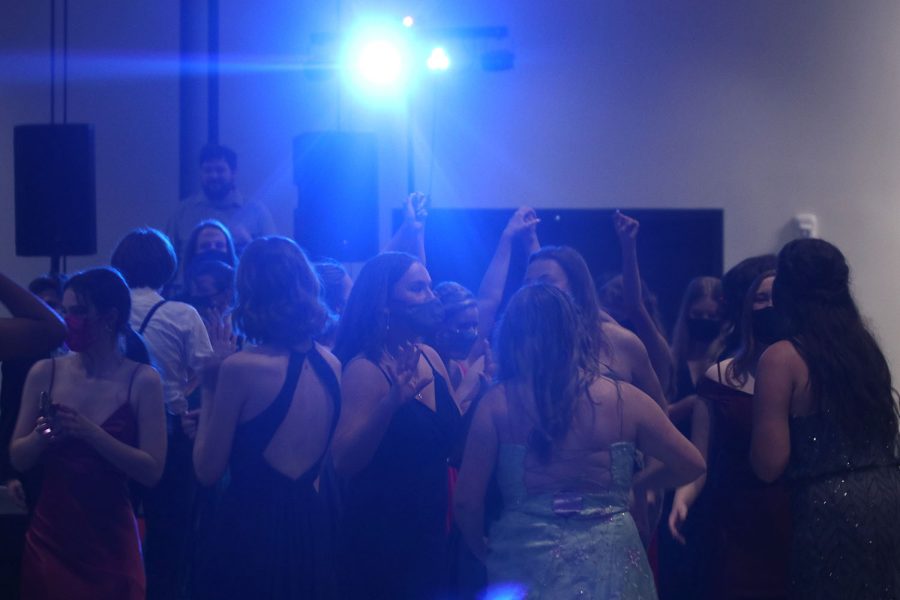 Light illuminated the dance floor as students danced to a mix of current hits and 80s and 90s songs during prom Saturday, May 8 at Fiorellas.