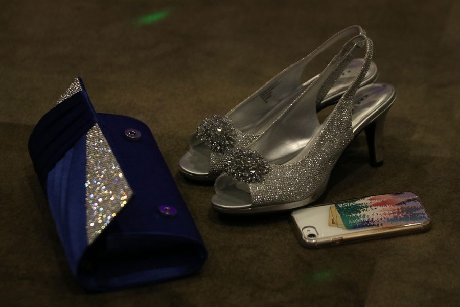 Some students abandoned their shoes, purses and cell phone on the floor as they rushed to the dance floor.