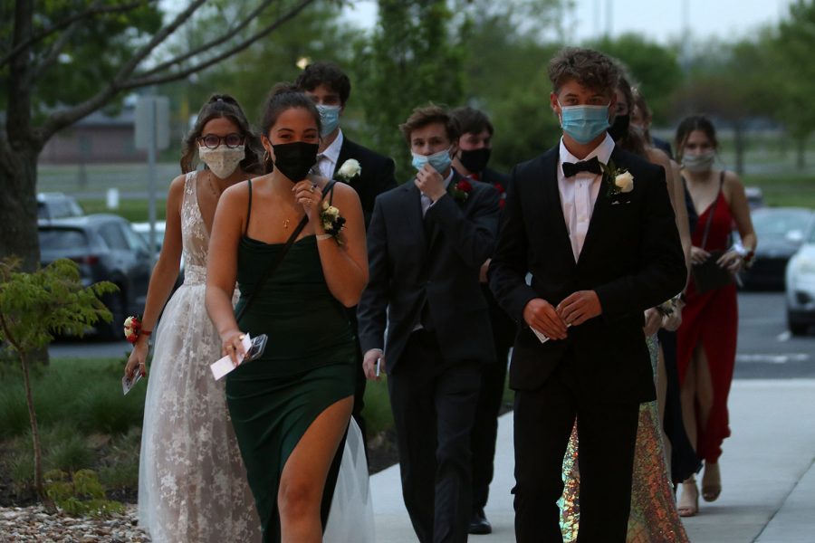 A group of seniors arrive at the prom with tickets in hand.