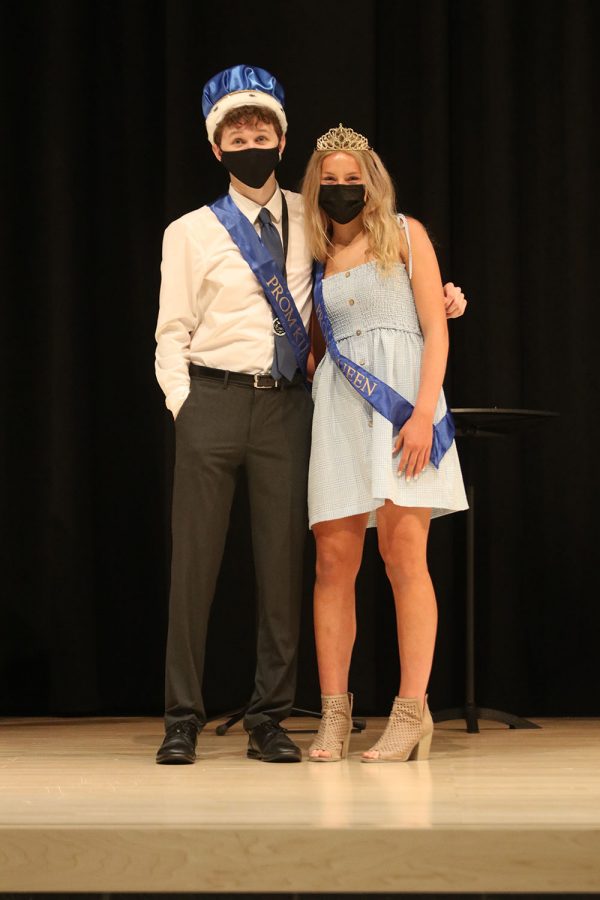 Posing for a picture together, seniors John Fraka and Molly Ricker celebrate being crowned prom king and queen. 