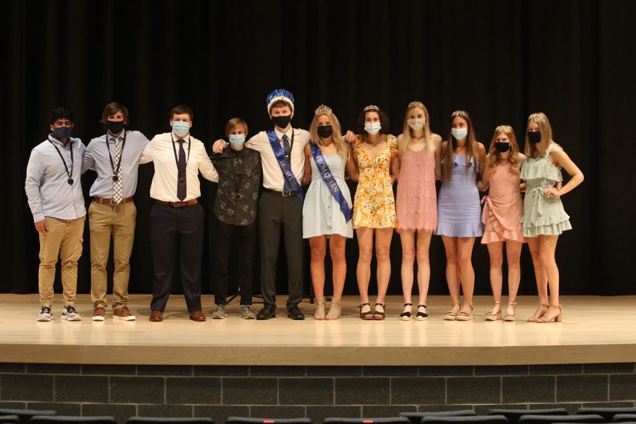 Commencing the ceremony, prom king and queen candidates, seniors Prathik Gadiraju, Jacob Hartman, Thomas Sellen, Cameron Coad, Nicole Crist, Taylor Sitzman, Sophie Lecuru, Ava VanInwegen, and Ellie Reese pose with the prom king and queen, seniors John Fraka and Molly Ricker.